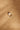 Side profile of a large square signet ring with a topaz set on top. The strong silhouette and raised setting give the design a confident, structured presence.