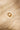 Textured gold band with a raw, hand-shaped surface. Captured from a front angle to highlight the warmth of the gold and the depth of the texture.